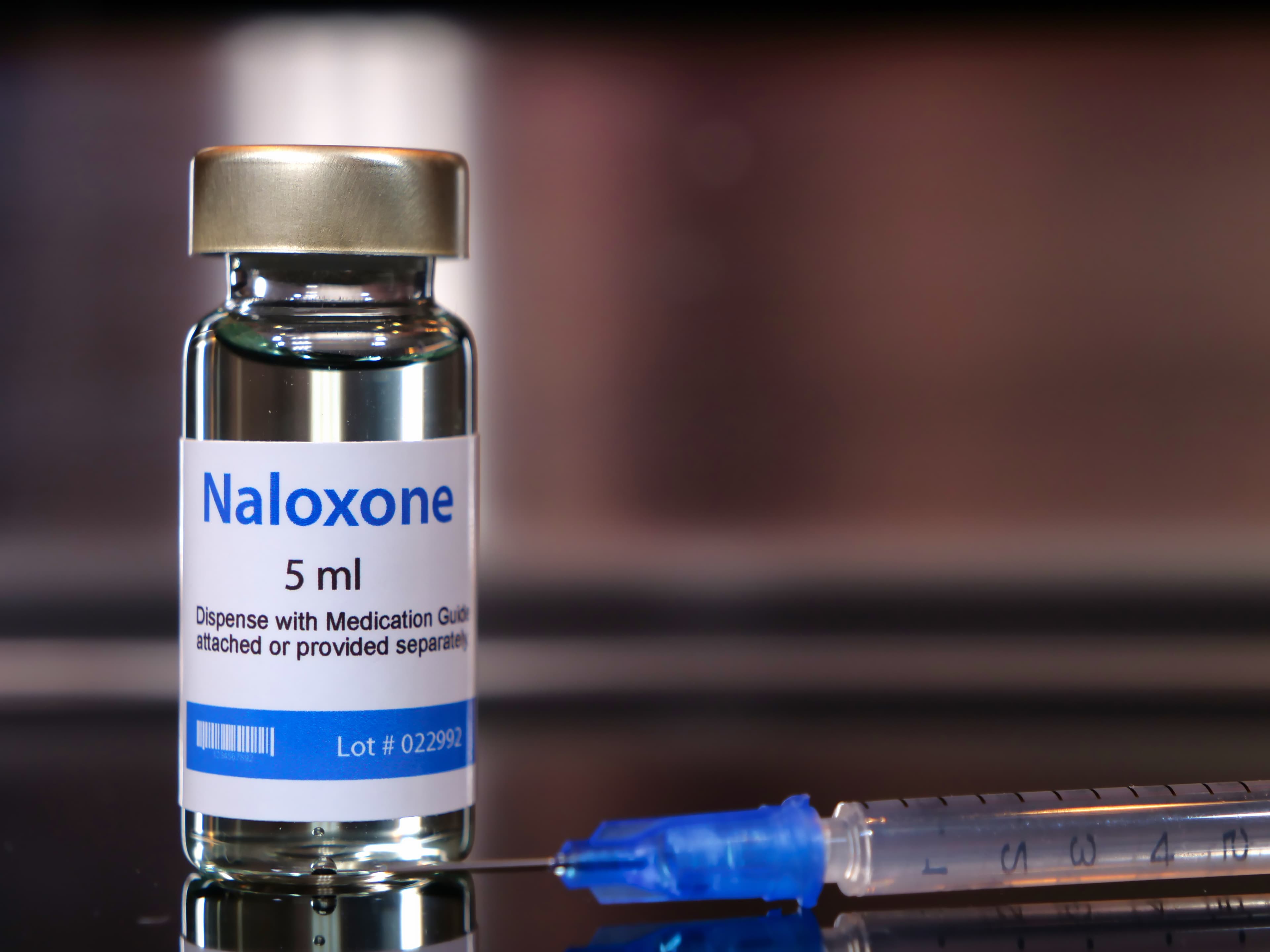 Vial of naloxone with syringe. a fast-acting medication to temporarily reverse the effects of an opioid overdose