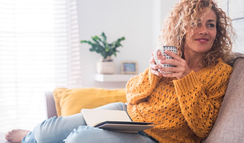 mobile_woman in yellow sweater