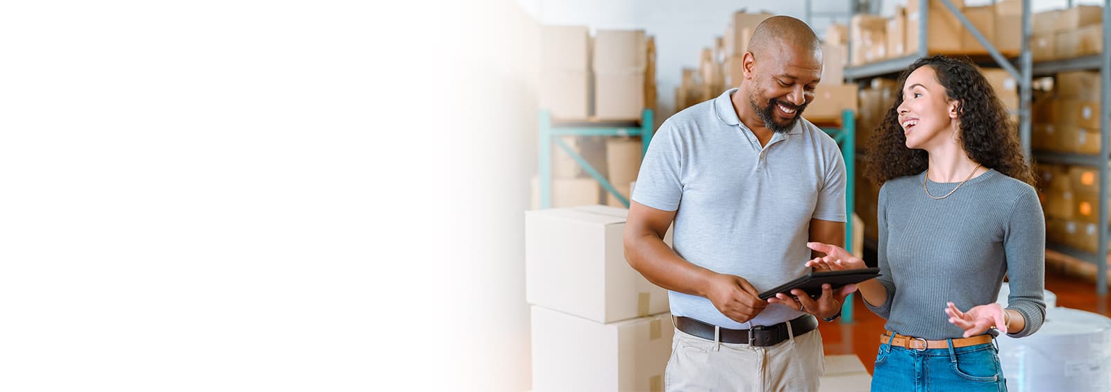 1255014654 man woman working warehouse header