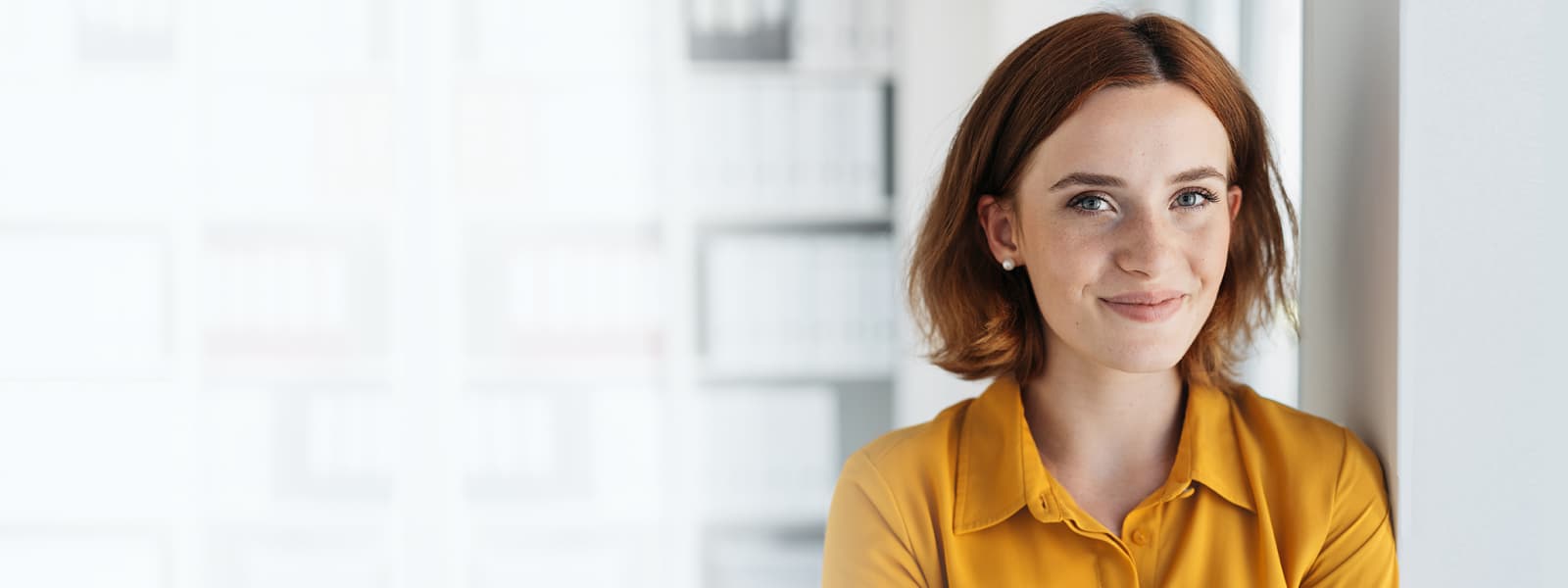 girl red hair yellow shirt commercial hero image